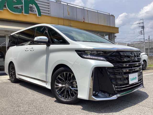 トヨタ ヴェルファイア ハイブリット Z プレミア 栃木県 2024(令6)年 1万km プラチナホワイトパールマイカ  ワンオーナー/ トヨタセーフティーセンス / メーカーナビ/ フルセグテレビ/ アラウンドビュー/ レーダークルーズコントロール/ スカイルーフ/ デジタルインナーミラー/ オートハイビーム/ プッシュスタート/ 両側パワースライドドア/ パワーバックドア/ ビルトインETC2.0/ LEDヘッドライト/ LEDフォグライト/ パドルシフト/ 12.1インチフリップダウンモニター/ ルーフシェイド/ サイドシェイド/ 前席、２列目席パワーシート/ クリアランスソナー/ コーナーセンサー/ 2列目オットマン/ ナビリモコン/ スペアスマートキー/ 純正フロアマット