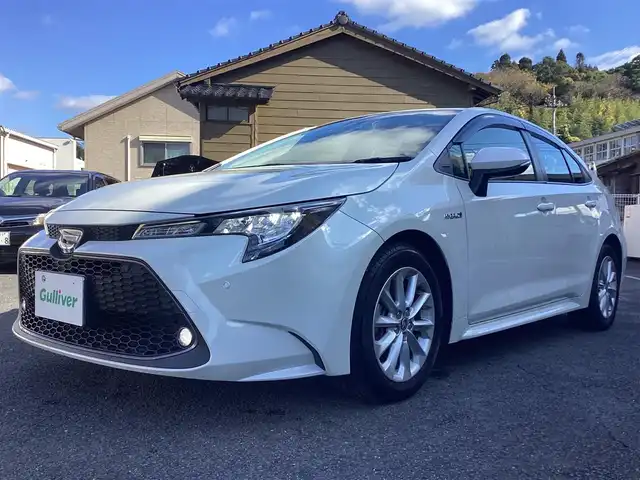 トヨタ カローラ ハイブリット S 鹿児島県 2020(令2)年 3.2万km ホワイトパールクリスタルシャイン ワンオーナー/禁煙車/プッシュスタート/純正ナビ/TV/バックカメラ/ビルトインETC/レーダーブレーキ/レーダークルーズコントロール/ブラインドスポットモニター/ドライブレコーダー/電動パーキング/レーンキープアシスト