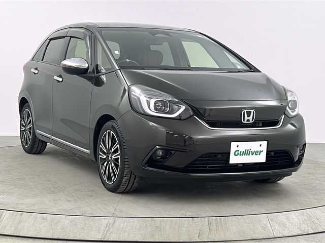ホンダ フィット e:HEVリュクス 熊本県 2020(令2)年 3.3万km 茶 純正８インチナビ/バックカメラ/アダプティブクルーズコントロール/ドライブレコーダー/ETC/オートハイビーム/シートヒーター/レーンキープアシスト/BT接続/ワイパーデアイサー/盗難防止装置/横滑り防止装置/衝突被害軽減システム/ステアリングリモコン/SRSエアバック （運転席/助手席/サイド/カーテン）/本革シート/純正16インチアルミホイール/禁煙車