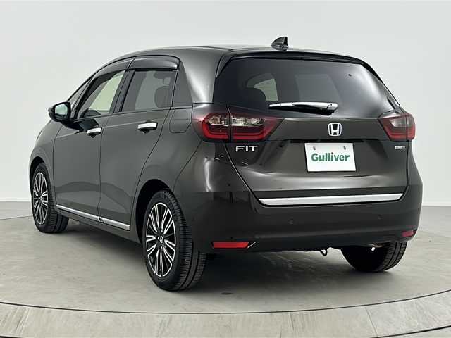 ホンダ フィット e:HEVリュクス 熊本県 2020(令2)年 3.3万km 茶 純正８インチナビ/バックカメラ/アダプティブクルーズコントロール/ドライブレコーダー/ETC/オートハイビーム/シートヒーター/レーンキープアシスト/BT接続/ワイパーデアイサー/盗難防止装置/横滑り防止装置/衝突被害軽減システム/ステアリングリモコン/SRSエアバック （運転席/助手席/サイド/カーテン）/本革シート/純正16インチアルミホイール/禁煙車