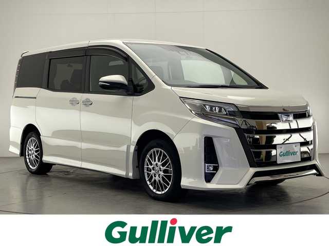 トヨタ ノア ハイブリッド Si ダブルバイビーⅡ 宮崎県 2020(令2)年 7万km ホワイトパールクリスタルシャイン ワンオーナー/Toyota Safety Sense/〇プリクラシュセーフティ/〇レーンディパーチャーアラート/〇パーキングサポートブレーキ/〇オートマチックハイビーム/〇クリアランスソナー/〇先行車発進告知/社外9インチSDナビ/フルセグTV/CD/DVD/Bluetooth/バックカメラ/社外11.6インチ後席フリップダウンモニター（TVM-FW1100）/両側パワースライドドア/ハーフレザーシート/シートヒーター/クルーズコントロール/前後ドライブレコーダー/純正16インチAW/スマートキー×2/ETC/保証書/取扱説明書