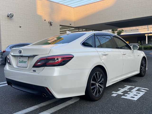 トヨタ クラウン ハイブリッド S Cパッケージ 広島県 2019(令1)年 7.7万km ホワイトパールクリスタルシャイン 登録時走行距離：76155km/メーカー純正ナビ/　CD DVD BT MSV フルセグTV/バックカメラ/プリクラッシュセーフティシステム/レーンキープアシスト/レーダークルーズコントロール/ブラインドスポットモニター/クリアランスソナー/ヘッドアップディスプレイ/リアクロストラフィックアラート/パーキングサポート/ロードサインアシスト/純正ドライブレコーダー/ビルトインETC/AC100V充電/MTモード付AT/ホールド機能付き電子パーキングブレーキ/パワーシート/シートヒーター/革巻きステアリング/ステアリングスイッチ/ステアリングヒーター/プッシュスタート/スマートキー