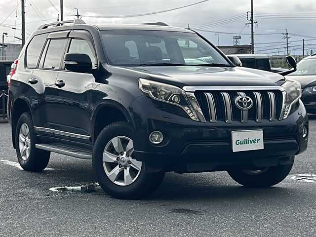 トヨタ ランドクルーザー プラド TX Lパッケージ 愛知県 2014(平26)年 10.1万km ブラック ワンオーナー/禁煙車/社外メモリナビ/　AM/FM/BT/CD/DVD/フルセグTV/前席パワーシート/前席シートヒーター/クルーズコントロール/革巻きステアリング/三列目電動格納シート/オートライト/LEDヘッドライト/フォグランプ/横滑り防止装置/純正フロアマット/W＋カーテンエアバッグ/取説/保証書/スペアキー