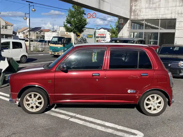 ダイハツ ミラ ジーノ ミニライトSP ターボ 愛知県 2002(平14)年 8万km レッドマイカメタリック ターボ車/キーレスエントリー/ルーフ色塗り(白系)/キセノンヘッドライト/純正アルミホイル/車検　令和9年8月