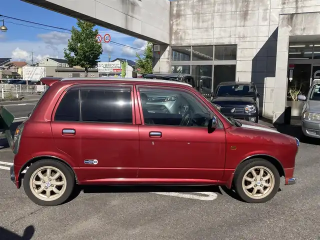 ダイハツ ミラ ジーノ ミニライトSP ターボ 愛知県 2002(平14)年 8万km レッドマイカメタリック ターボ車/キーレスエントリー/ルーフ色塗り(白系)/キセノンヘッドライト/純正アルミホイル/車検　令和9年8月