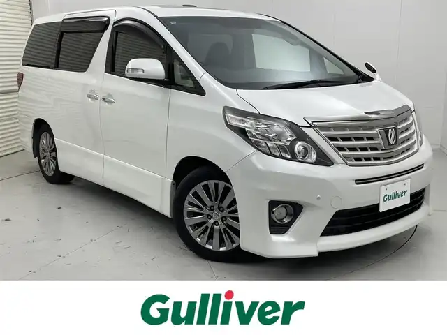トヨタ アルファード 茨城県 2013(平25)年 2.3万km ホワイトパールクリスタルシャイン 社外ナビ/フルセグ視聴可/Bluetooth接続/DVD再生可/ETC/クルコン/後席モニター/サンルーフ/オットマン/電動リアゲート/純正AW/純正フロアマット