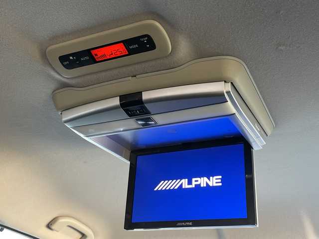 日産 エルグランド 250ハイウェイスター 静岡県 2011(平23)年 8.9万km ブリリアントホワイトパール 社外ナビ　/社外フリップダウンモニター　/両側パワスラ　/半革シート　/革巻きステアリング　/オートライト　/ウィンカーミラー　/木目調パネル/ETC　/純正１８インチＡＷ　/スマートキー　/スペアキー　/保証書　/取説