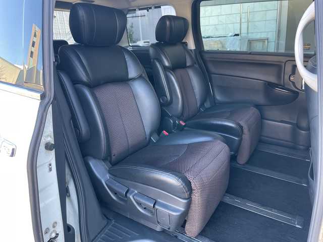 日産 エルグランド 250ハイウェイスター 静岡県 2011(平23)年 8.9万km ブリリアントホワイトパール 社外ナビ　/社外フリップダウンモニター　/両側パワスラ　/半革シート　/革巻きステアリング　/オートライト　/ウィンカーミラー　/木目調パネル/ETC　/純正１８インチＡＷ　/スマートキー　/スペアキー　/保証書　/取説