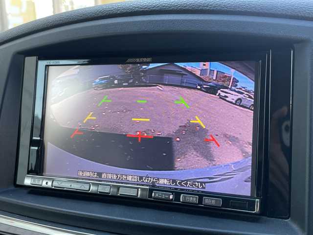 日産 エルグランド 250ハイウェイスター 静岡県 2011(平23)年 8.9万km ブリリアントホワイトパール 社外ナビ　/社外フリップダウンモニター　/両側パワスラ　/半革シート　/革巻きステアリング　/オートライト　/ウィンカーミラー　/木目調パネル/ETC　/純正１８インチＡＷ　/スマートキー　/スペアキー　/保証書　/取説