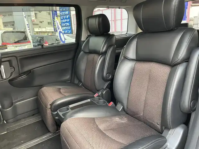 日産 エルグランド 250ハイウェイスター 和歌山県 2011(平23)年 8.9万km ブリリアントホワイトパール (株)IDOMが運営する【じしゃロン和歌山店】の自社ローン対象車両になります。こちらは現金ご利用時の価格です。/自社ローンご希望の方は別途その旨お申付け下さい。/社外ナビ　/社外フリップダウンモニター　/両側パワスラ　/半革シート　/革巻きステアリング　/オートライト　/ウィンカーミラー　/木目調パネル/ETC　/純正１８インチＡＷ　/スマートキー　/スペアキー　/保証書　/取説