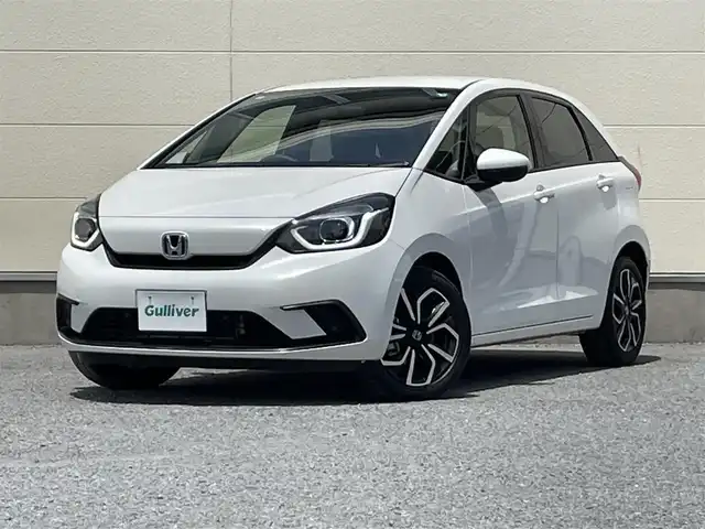 ホンダ フィット e:HEVベーシック 茨城県 2021(令3)年 2.9万km 白 社外ナビ７インチ/ワンセグテレビ/バックカメラ/クルーズコントロール/オートライト/LEDヘッドライト/カーテンエアバック/パワステ/パワーウィンドウ/横滑り防止/ABS/スマートキー/純正フロアマット