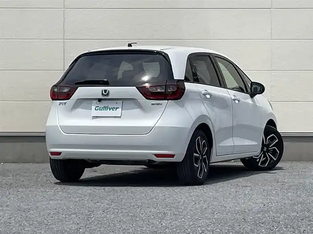 ホンダ フィット e:HEVベーシック 茨城県 2021(令3)年 2.9万km 白 社外ナビ７インチ/ワンセグテレビ/バックカメラ/クルーズコントロール/オートライト/LEDヘッドライト/カーテンエアバック/パワステ/パワーウィンドウ/横滑り防止/ABS/スマートキー/純正フロアマット