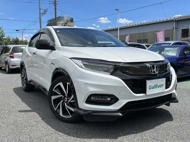 ホンダ ヴェゼル ハイブリッド RS ホンダセンシング 埼玉県 2018(平30)年 5万km プラチナホワイトパール 	ナビ装着用スペシャルパッケージ＋ETC車載器/	Honda SENSING/	前席用 i-サイドエアバッグシステム＋サイドカーテンエアバッグシステム(前席/後席対応)/	コンフォートビューパッケージ/	LEDヘッドライト/	LEDフォグライト/	コンビシート(ウルトラスエード)/	運転席＆助手席シートヒーター/	18インチアルミホイール/　　 ハーフレザーシート/     DVD再生機能/　　 フルセグ/　　 バックカメラ/      クルーズコントロール（追従走行）