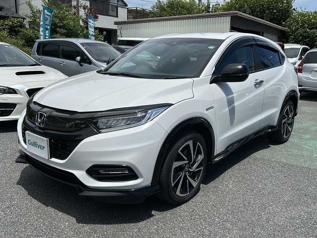 ホンダ ヴェゼル ハイブリッド RS ホンダセンシング 埼玉県 2018(平30)年 5万km プラチナホワイトパール 	ナビ装着用スペシャルパッケージ＋ETC車載器/	Honda SENSING/	前席用 i-サイドエアバッグシステム＋サイドカーテンエアバッグシステム(前席/後席対応)/	コンフォートビューパッケージ/	LEDヘッドライト/	LEDフォグライト/	コンビシート(ウルトラスエード)/	運転席＆助手席シートヒーター/	18インチアルミホイール/　　 ハーフレザーシート/     DVD再生機能/　　 フルセグ/　　 バックカメラ/      クルーズコントロール（追従走行）