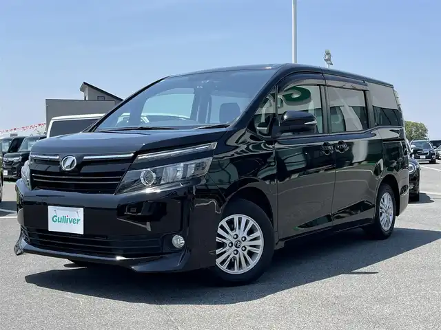 トヨタ ヴォクシー V 奈良県 2014(平26)年 7.4万km ブラック アルパインナビ/(AM/FM/CD/DVD/BT/USB/HDMI/SD/フルセグTV)/バックカメラ/アルパインフリップダウンモニター/片側パワースライドドア/オートライト/オートマチックハイビーム/ステアリングスイッチ/アイドリングストップ/純正フロアマット/電格ウインカーミラー