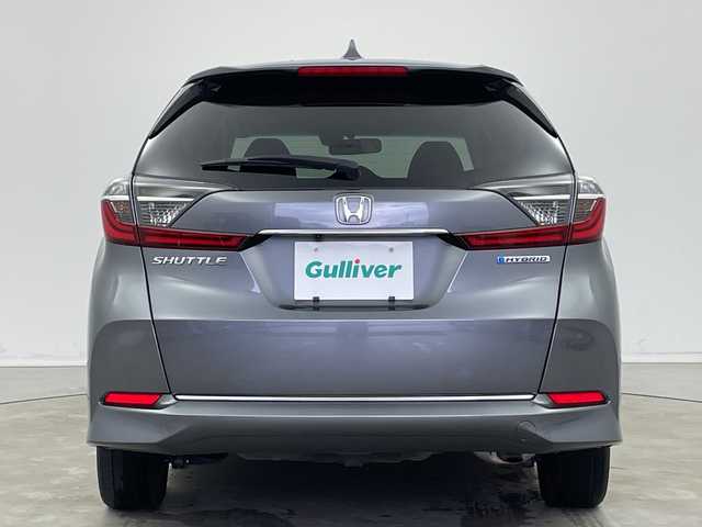 ホンダ シャトル ハイブリッド ホンダセンシング 新潟県 2020(令2)年 6.8万km シャイニンググレーM ホンダセンシング/　・衝突軽減ブレーキ/　・レーダークルーズコントロール/　・レーンキープアシスト/純正ディーラーOPナビ/バックカメラ/ビルトインETC/プッシュスタート/社外15インチアルミホイール/横滑り防止機能/電動格納ミラー/ウィンカーミラー/純正フロアマット/ドアバイザー