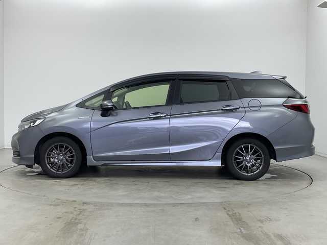 ホンダ シャトル ハイブリッド ホンダセンシング 新潟県 2020(令2)年 6.8万km シャイニンググレーM ホンダセンシング/　・衝突軽減ブレーキ/　・レーダークルーズコントロール/　・レーンキープアシスト/純正ディーラーOPナビ/バックカメラ/ビルトインETC/プッシュスタート/社外15インチアルミホイール/横滑り防止機能/電動格納ミラー/ウィンカーミラー/純正フロアマット/ドアバイザー