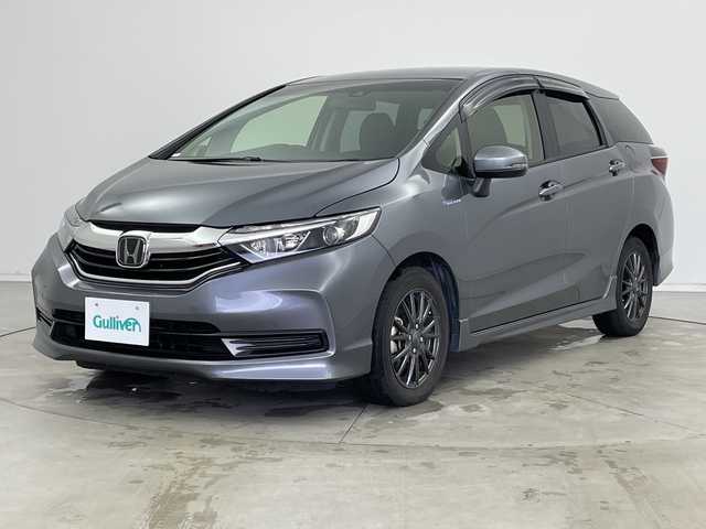 ホンダ シャトル ハイブリッド ホンダセンシング 新潟県 2020(令2)年 6.8万km シャイニンググレーM ホンダセンシング/　・衝突軽減ブレーキ/　・レーダークルーズコントロール/　・レーンキープアシスト/純正ディーラーOPナビ/バックカメラ/ビルトインETC/プッシュスタート/社外15インチアルミホイール/横滑り防止機能/電動格納ミラー/ウィンカーミラー/純正フロアマット/ドアバイザー