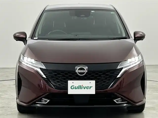 日産 オーラ G 福岡県 2022(令4)年 0.9万km バーガンディー 純正９型ナビ　/全方位カメラ　/ビルトインＥＴＣ２．０　/前後ドラレコ　/ＢＯＳＥサウンド　/ワイヤレス充電　/デジタルルームミラー　/ＡＣＣ　/プロパイロット　/コーナーセンサー　/エマージェンシーブレーキ　/ＢＳＭ
