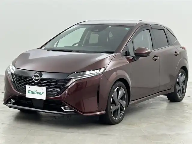 日産 オーラ G 福岡県 2022(令4)年 0.9万km バーガンディー 純正９型ナビ　/全方位カメラ　/ビルトインＥＴＣ２．０　/前後ドラレコ　/ＢＯＳＥサウンド　/ワイヤレス充電　/デジタルルームミラー　/ＡＣＣ　/プロパイロット　/コーナーセンサー　/エマージェンシーブレーキ　/ＢＳＭ