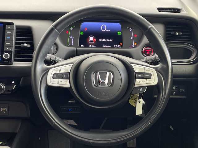 ホンダ フィット e:HEVリュクス 愛知県 2020(令2)年 4.8万km ルナシルバーM ／純正９インチナビ/／ＣＤ　ＤＶＤ　ＢＴ　ＳＤ　ＦＭ　ＡＭ/／フルセグＴＶ/／ホンダコネクト/／バックカメラ/／ETC/／ホンダセンシング/／アダプティブクルーズコントロール/／衝突被害軽減システム/／スマートキー/／スペアキー/／ハーフレザーシート/／前席シートヒーター/／ステアリングヒーター/／前後コーナーセンサー/／純正フロアマット/／電動パーキングブレーキ/／ドアバイザー/／LEDオートヘッドライト/／純正フォグランプ