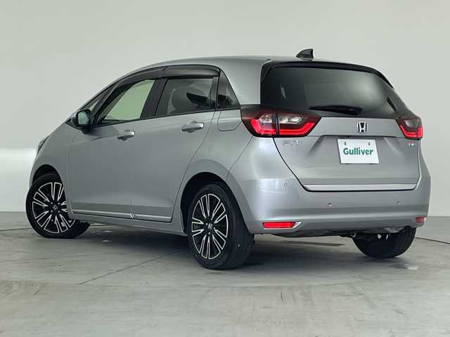ホンダ フィット e:HEVリュクス 愛知県 2020(令2)年 4.8万km ルナシルバーM ／純正９インチナビ/／ＣＤ　ＤＶＤ　ＢＴ　ＳＤ　ＦＭ　ＡＭ/／フルセグＴＶ/／ホンダコネクト/／バックカメラ/／ETC/／ホンダセンシング/／アダプティブクルーズコントロール/／衝突被害軽減システム/／スマートキー/／スペアキー/／ハーフレザーシート/／前席シートヒーター/／ステアリングヒーター/／前後コーナーセンサー/／純正フロアマット/／電動パーキングブレーキ/／ドアバイザー/／LEDオートヘッドライト/／純正フォグランプ
