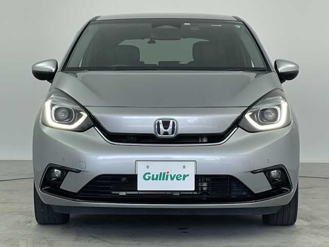 ホンダ フィット e:HEVリュクス 愛知県 2020(令2)年 4.8万km ルナシルバーM ／純正９インチナビ/／ＣＤ　ＤＶＤ　ＢＴ　ＳＤ　ＦＭ　ＡＭ/／フルセグＴＶ/／ホンダコネクト/／バックカメラ/／ETC/／ホンダセンシング/／アダプティブクルーズコントロール/／衝突被害軽減システム/／スマートキー/／スペアキー/／ハーフレザーシート/／前席シートヒーター/／ステアリングヒーター/／前後コーナーセンサー/／純正フロアマット/／電動パーキングブレーキ/／ドアバイザー/／LEDオートヘッドライト/／純正フォグランプ