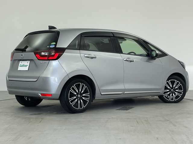 ホンダ フィット e:HEVリュクス 愛知県 2020(令2)年 4.8万km ルナシルバーM ／純正９インチナビ/／ＣＤ　ＤＶＤ　ＢＴ　ＳＤ　ＦＭ　ＡＭ/／フルセグＴＶ/／ホンダコネクト/／バックカメラ/／ETC/／ホンダセンシング/／アダプティブクルーズコントロール/／衝突被害軽減システム/／スマートキー/／スペアキー/／ハーフレザーシート/／前席シートヒーター/／ステアリングヒーター/／前後コーナーセンサー/／純正フロアマット/／電動パーキングブレーキ/／ドアバイザー/／LEDオートヘッドライト/／純正フォグランプ