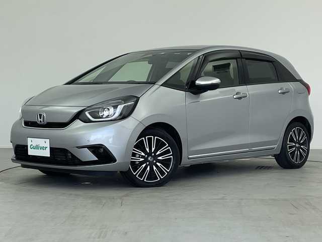 ホンダ フィット e:HEVリュクス 愛知県 2020(令2)年 4.8万km ルナシルバーM ／純正９インチナビ/／ＣＤ　ＤＶＤ　ＢＴ　ＳＤ　ＦＭ　ＡＭ/／フルセグＴＶ/／ホンダコネクト/／バックカメラ/／ETC/／ホンダセンシング/／アダプティブクルーズコントロール/／衝突被害軽減システム/／スマートキー/／スペアキー/／ハーフレザーシート/／前席シートヒーター/／ステアリングヒーター/／前後コーナーセンサー/／純正フロアマット/／電動パーキングブレーキ/／ドアバイザー/／LEDオートヘッドライト/／純正フォグランプ
