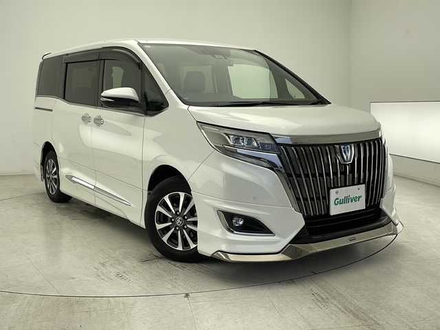 トヨタ エスクァイア ハイブリッド Gi プレミアムパッケージ ブラックテーラード 千葉県 2020(令2)年 4.8万km ホワイトパールクリスタルシャイン 純正10インチナビ/　CD/DVD/Bluetooth/フルセグTV/HDMI/モデリスタフルエアロ/純正フリップダウンモニター/トヨタセーフティセンス/クルーズコントロール/車線逸脱警報/衝突軽減ブレーキ/クリアランスソナー/オートハイビーム/両側パワスラ/ハーフレザーシート/前席シートヒーター/ステアリングヒーター/前後ドラレコ/ビルトインETC/LEDライト/フォグランプ/ロールサンシェード/シートバックテーブル/フロアマット/ドアバイザー