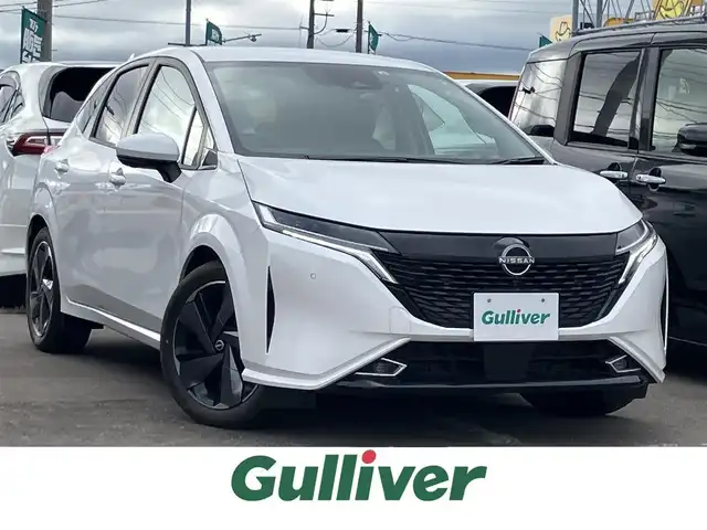 日産 オーラ G FOUR レザーエディション 道南・函館 2022(令4)年 0.8万km ピュアホワイトパール 純正9インチコネクトナビ/フルセグTV/バックカメラ/アラウンドビューモニター/BOSEパーソナルプラスサウンドシステム/ワイヤレス充電器/プロパイロット/LEDオートヘッドライト/全方位運転支援システム/踏み間違え防止アシスト/インテリジェントエマージェンシーブレーキ/標識認識機能/車線逸脱警報/後退時検知機能/SOSコール/レザーシート/シートヒーター/ステアリングヒーター/ETC2.0/禁煙車