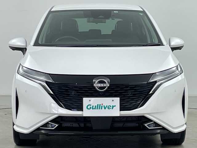 日産 オーラ G FOUR レザーエディション 道央・札幌 2022(令4)年 0.8万km ピュアホワイトパール ・禁煙車/・純正9インチナビ&TV&BT&USB&HDMI/・バックカメラ/・アラウンドビューモニター/・BOSEパーソナルプラスサウンドシステム/・プロパイロット/・全方位運転支援システム/・踏み間違え防止アシスト/・インテリジェントエマージェンシーブレーキ/・標識認識機能/・車線逸脱警報/・後退時検知機能/・SOSコール/・前席シートヒーター/・レザーシート/・ステアリングヒーター/・前方ドライブレコーダー/・ワイヤレス充電器/・ETC2.0/・純正フロアマット/・LEDオートヘッドライト/・フォグランプ/・オートライト/・スマートキー