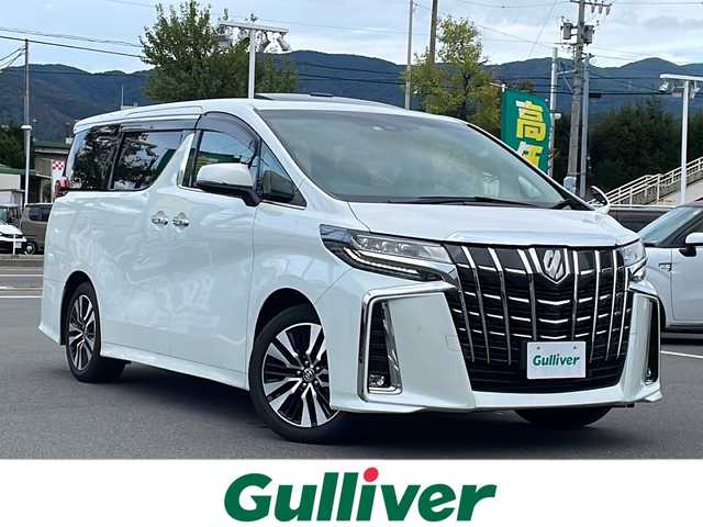 トヨタ アルファード S Cパッケージ 長野県 2022(令4)年 2.6万km ホワイトパールクリスタルシャイン 純正９型ナビ機能付きディスプレイオーディオ(AM/FM/BT/TV/DVD/USB/AppleCarPlay)/ツインムーンルーフ/12.1型後席フリップダウンモニター/フルセグTV/純正ビルトインETC/純正ドライブレコーダー/バックカメラ/両側電動スライドドア/電動パワーバックドア/AC100Vアクセサリーコンセント/助手席＋後列オットマン/後席サンシェード/追従型クルーズコントロール/シーケンシャルターンランプ/三眼LEDヘッドライト/オートライト/アダプティブハイビーム/アダプティブフロントライティングシステム/フォグランプ/純正フロアマット/純正18インチアルミホイール/レザーシート(シートヒーター、エアシート)/電子パーキング/革巻きステアリング/ステアリングスイッチ/ステアリングヒーター/トヨタセーフティセンス/プリクラッシュセーフティ/ロードサインアシスト/レーントレーシングアシスト/ブラインドスポットモニター/パーキングサポートブレーキ/リヤクロストラフィックアラート/先行車発進告知/前後クリアランスソナー/スマートキー/スペアキー/スペアタイヤ