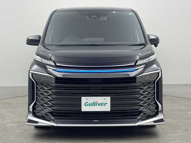 トヨタ ヴォクシー ハイブリッド S－Z 三重県 2022(令4)年 2.8万km グリッターブラックガラスフレーク 禁煙車　　/純正ナビ/DVDデッキ/バックカメラ　/純正１４インチフリップダウンモニター　/両側パワースライドドア　/モデリスタエアロ（フロント、リア）　/パワーバックドア　/デジタルインナーミラー　/ビルトインＥＴＣ２．０　/トヨタセーフティセンス/衝突軽減ブレーキ/レーンキープアシスト /全席シートヒーター/ステアリングヒーター/前後ドライブレコーダー/サイド/カーテンエアバッグ