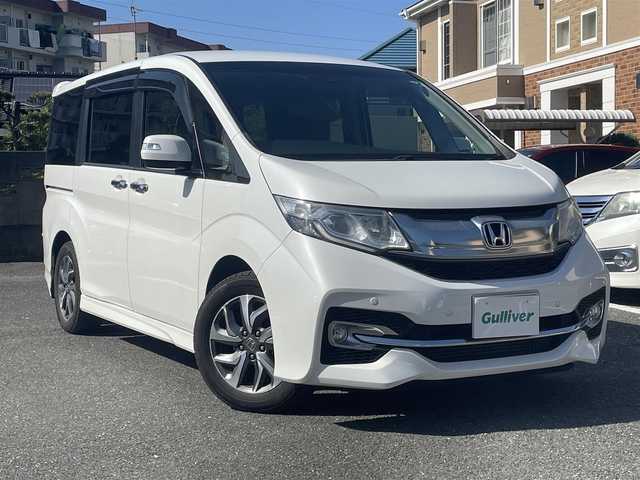 ホンダ ステップワゴン スパーダ ホンダセンシング 福岡県 2016(平28)年 12.3万km ホワイトオーキッドパール ワンオーナー/純正ナビ/（AM/FM/CD/DVD/SD/Bluetooth/ミュージックボックス/フルセグTV）/フリップダウンモニター/両側パワースライドドア/ドライブレコーダー/横滑り防止/衝突軽減/レーンキープ/パーキングアシスト/クルーズコントロール追従あり/ビルドインETC/アイドリングストップ/プッシュスタート/純正フロアマット/純正アルミホイール/オートライト/フォグランプ/電格ミラー/ECOモード/スペアキー×1/保証書/取扱説明書