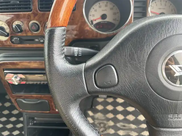 ダイハツ ミラ ジーノ 岡山県 2004(平16)年 15.9万km ホワイトパールマイカ 登録時走行距離：158192km/禁煙車/5速MT/社外オーディオ（DEH-380）/ETC/ブラウンウッドインテリア/ウッドコンピステアリング/ハーフレザーシート/電動格納ミラー/パワーウインドウ/パワーステアリング/メカニカルキー/スペアキー/純正ホイールカバー/取扱説明書/新車時整備手帳（保証書）