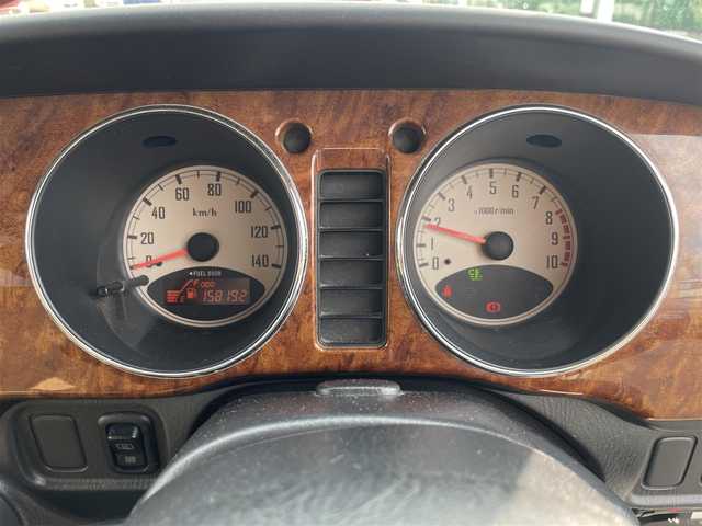 ダイハツ ミラ ジーノ 岡山県 2004(平16)年 15.9万km ホワイトパールマイカ 登録時走行距離：158192km/禁煙車/5速MT/社外オーディオ（DEH-380）/ETC/ブラウンウッドインテリア/ウッドコンピステアリング/ハーフレザーシート/電動格納ミラー/パワーウインドウ/パワーステアリング/メカニカルキー/スペアキー/純正ホイールカバー/取扱説明書/新車時整備手帳（保証書）