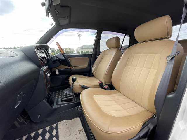 ダイハツ ミラ ジーノ 岡山県 2004(平16)年 15.9万km ホワイトパールマイカ 登録時走行距離：158192km/禁煙車/5速MT/社外オーディオ（DEH-380）/ETC/ブラウンウッドインテリア/ウッドコンピステアリング/ハーフレザーシート/電動格納ミラー/パワーウインドウ/パワーステアリング/メカニカルキー/スペアキー/純正ホイールカバー/取扱説明書/新車時整備手帳（保証書）