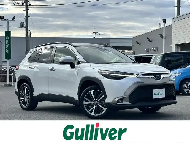 トヨタ カローラ クロス ハイブリッド Z 鳥取県 2023(令5)年 2.9万km プラチナホワイトパールマイカ ワンオーナー/パノラマルーフ/ＨＤＤナビ/３６０°カメラ/フルセグＴＶ　Ｂｌｕｅｔｏｏｔｈ　ＤＶＤ　ＣＤ/ＡＣＣ/ブラインドスポット/レーンアシスト/衝突被害軽減ブレーキ/オートホールド/Ｑｉ充電/ビルトインＥＴＣ２．０/前後ドライブレコーダー/運転席パワーシート/ハーフレザー/前席シートヒーター/ステアリングヒーター/LEDライト/フォグランプ/オートライト/オートハイビーム/スマートキー/スペアキー/新車保証書/取扱説明書