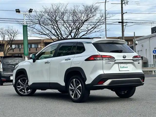 トヨタ カローラ クロス ハイブリッド Z 鳥取県 2023(令5)年 2.9万km プラチナホワイトパールマイカ ワンオーナー/パノラマルーフ/ＨＤＤナビ/３６０°カメラ/フルセグＴＶ　Ｂｌｕｅｔｏｏｔｈ　ＤＶＤ　ＣＤ/ＡＣＣ/ブラインドスポット/レーンアシスト/衝突被害軽減ブレーキ/オートホールド/Ｑｉ充電/ビルトインＥＴＣ２．０/前後ドライブレコーダー/運転席パワーシート/ハーフレザー/前席シートヒーター/ステアリングヒーター/LEDライト/フォグランプ/オートライト/オートハイビーム/スマートキー/スペアキー/新車保証書/取扱説明書