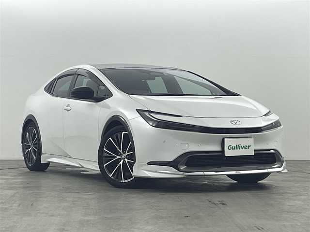 トヨタ プリウス Z 福島県 2023(令5)年 0.7万km プラチナホワイトパールマイカ トヨタセーフティーセンス /・PCS/・車線逸脱警報/・レーダークルーズコントロール/・オートマチックハイビーム/・ブラインドスポットモニター/・パーキングサポート/・レーンアシスト/全方位カメラ /純正ナビ/【AM/FM/MIRACASTO/Bluetooth/フルセグ】 /モデリスタエアロ /サンルーフ/レザーシート/純正ETC2.0　/電子パーキング　/・ブレーキホールド　/ハンドルヒーター　/・シートヒーター　/・エアシート　/・パワーシート　/電動リアゲート　/ステアリングスイッチ/・革巻きステアリング/・チルトステアリング/プッシュスタート/・スマートキー/LEDライト/・オートライト/AC100V/オートミラー/取扱説明書/・保証書