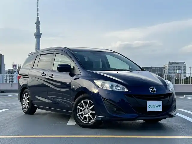 マツダ プレマシー 20E 東京都 2011(平23)年 5.3万km ストーミーブルーマイカ 純正ナビ（NX111)(CD/ワンセグ）/両側パワースライドドア/電動格納ミラー/ETC/社外１５インチアルミ/バイザー・マット/スペアキー１本/保証書/取説