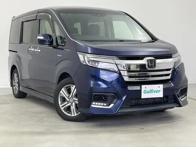 ホンダ ステップワゴン スパーダ ハイブリッド G EX ホンダセンシング 新潟県 2018(平30)年 5.8万km オブシダンブルーパール 純正メモリナビ/　フルセグTV/Bluetooth/CD/DVD/USB/ホンダセンシング/・衝突被害軽減ブレーキ/・誤発進抑制機能/・歩行者事故低減ステアリング/・路外逸脱抑制機能/・アダプティブ・クルーズ・コントロール/・車線維持支援システム/・先行車発進お知らせ機能/・標識認識機能/ハーフレザーシート/前席シートヒーター/両側パワースライドドア/純正ドライブレコーダー/全方位モニター/ビルトインETC/LEDヘッドライト/ステアリングスイッチ