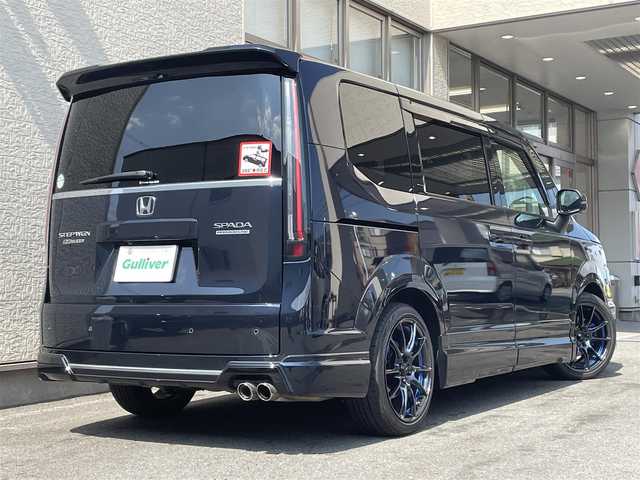 ホンダ ステップワゴン スパーダ プレミアムライン 大阪府 2022(令4)年 1.3万km ミッドナイトブルービームM ワンオーナー/純正フルエアロパーツ/純正１２インチSDナビ/（フルセグ/BT/CD/DVD)/純正15インチフリップダウンモニター/レーダークルーズコントロール/全方位モニター/ブラインドスポットモニター/前後コーナーセンサー/衝突軽減システム/レーンキープアシスト/両側パワースライドドア/ハーフレザーシート/全席シートヒーター/ETC2.0/前後ドライブレコーダー/社外18インチAW（/保証書/取扱説明書/スペアキー　有