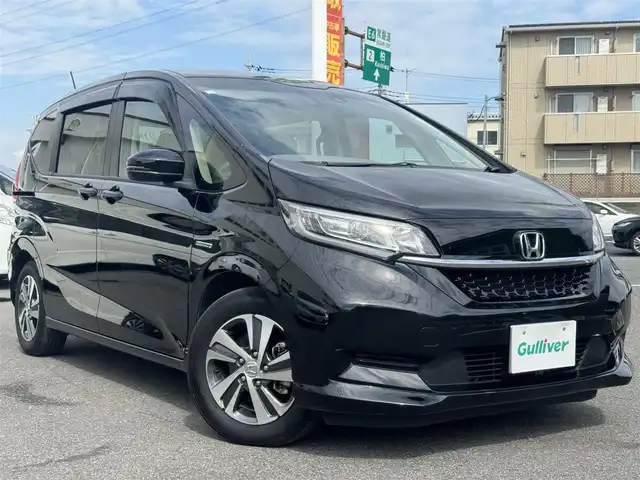 ホンダ フリード ハイブリット G ホンダセンシング 千葉県 2020(令2)年 5.4万km クリスタルブラックパール Honda SENSING/　衝突軽減ブレーキ（CMBS）/　誤発進抑制機能/　歩行者事故低減ステアリング/　先行車発進お知らせ機能/　標識認識機能/　路外逸脱抑制機能/　アダプティブクルーズコントロール（ACC）/　車線維持支援/　システム（LKAS）/　後方誤発進抑制機能/純正8インチナビ/フルセグTV/Bluetooth/CarPlay/バックカメラ/D/N席シートヒーター/両側電動スライドドア/前後ドライブレコーダー/LEDライト/ETC/純正15インチAW