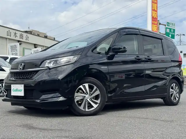 ホンダ フリード ハイブリット G ホンダセンシング 千葉県 2020(令2)年 5.4万km クリスタルブラックパール Honda SENSING/　衝突軽減ブレーキ（CMBS）/　誤発進抑制機能/　歩行者事故低減ステアリング/　先行車発進お知らせ機能/　標識認識機能/　路外逸脱抑制機能/　アダプティブクルーズコントロール（ACC）/　車線維持支援/　システム（LKAS）/　後方誤発進抑制機能/純正8インチナビ/フルセグTV/Bluetooth/CarPlay/バックカメラ/D/N席シートヒーター/両側電動スライドドア/前後ドライブレコーダー/LEDライト/ETC/純正15インチAW