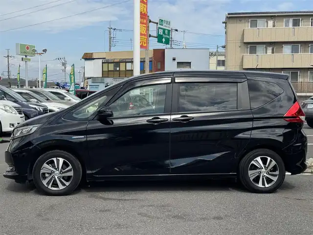 ホンダ フリード ハイブリット G ホンダセンシング 千葉県 2020(令2)年 5.4万km クリスタルブラックパール Honda SENSING/　衝突軽減ブレーキ（CMBS）/　誤発進抑制機能/　歩行者事故低減ステアリング/　先行車発進お知らせ機能/　標識認識機能/　路外逸脱抑制機能/　アダプティブクルーズコントロール（ACC）/　車線維持支援/　システム（LKAS）/　後方誤発進抑制機能/純正8インチナビ/フルセグTV/Bluetooth/CarPlay/バックカメラ/D/N席シートヒーター/両側電動スライドドア/前後ドライブレコーダー/LEDライト/ETC/純正15インチAW
