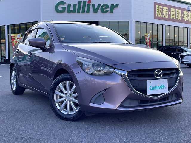 マツダ デミオ 13S 長野県 2014(平26)年 8万km スモーキーローズマイカ 禁煙車/純正ナビ/バックカメラ/ＢｌｕｅｔｏｏｔｈAudio/（ＵＳＢ／ＦＭ／ＡＭ）/社外15インチアルミホイール/ＥＴＣ/ドライブレコーダー/ステアリングスイッチ/アイドリングストップ/オートライト/スマートキー/プッシュスタート/電動格納ミラー/純正フロアマット/HIDライト/横滑り防止/ドアバイザー/Wエアバッグ/ABS