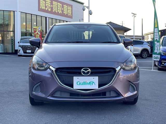 マツダ デミオ 13S 長野県 2014(平26)年 8万km スモーキーローズマイカ 禁煙車/純正ナビ/バックカメラ/ＢｌｕｅｔｏｏｔｈAudio/（ＵＳＢ／ＦＭ／ＡＭ）/社外15インチアルミホイール/ＥＴＣ/ドライブレコーダー/ステアリングスイッチ/アイドリングストップ/オートライト/スマートキー/プッシュスタート/電動格納ミラー/純正フロアマット/HIDライト/横滑り防止/ドアバイザー/Wエアバッグ/ABS