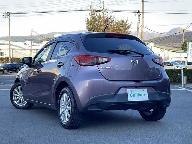 マツダ デミオ 13S 長野県 2014(平26)年 8万km スモーキーローズマイカ 禁煙車/純正ナビ/バックカメラ/ＢｌｕｅｔｏｏｔｈAudio/（ＵＳＢ／ＦＭ／ＡＭ）/社外15インチアルミホイール/ＥＴＣ/ドライブレコーダー/ステアリングスイッチ/アイドリングストップ/オートライト/スマートキー/プッシュスタート/電動格納ミラー/純正フロアマット/HIDライト/横滑り防止/ドアバイザー/Wエアバッグ/ABS